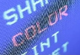 Photo of a portion of a computer monitor up close, showing pixels formed into letters and words.