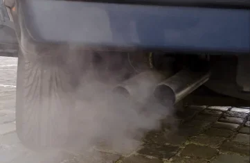 Exhaust from fossil fuel burning car engine.