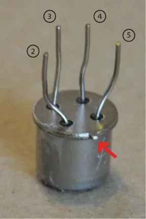 Photo shows a VOC sensor with a red arrow pointing to the notch.
