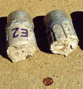 Photo shows a hand-sized cylinder of concrete, broken in half.