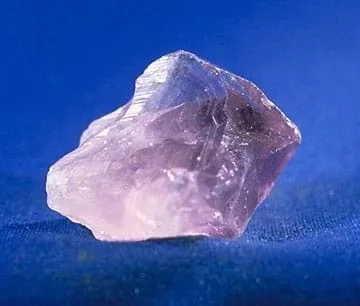 A translucent purple amethyst crystal.