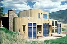 Photo showing south-facing windows of a modern family home.