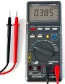 Photo shows a black box with LCD screen, buttons and dials.