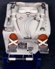 A photograph of a space shuttle WCS, Waste Collection System.