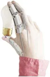 A photograph of a human hand that has been superimposed with mechanical fingers. The hand, which shows jointed finger, holds a light bulb.
