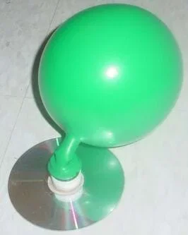 A photo shows the Hovercraft Racer activity setup: a balloon attached to (and above) a compact disc, causing the CD to slide across a linoleum floor.