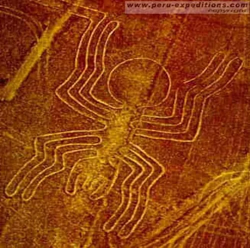 Sepia-colored photograph of what looks like a spider shape formed in the surface of the Earth.