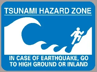 A Tsunami Hazard Zone sign that warns people to seek higher ground in the event of an earthquake.