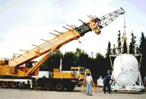 Photograph of a large crane lifting a heavy object.