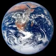 Photo shows an orb of swirling blue, white, green and brown colors with a black background.