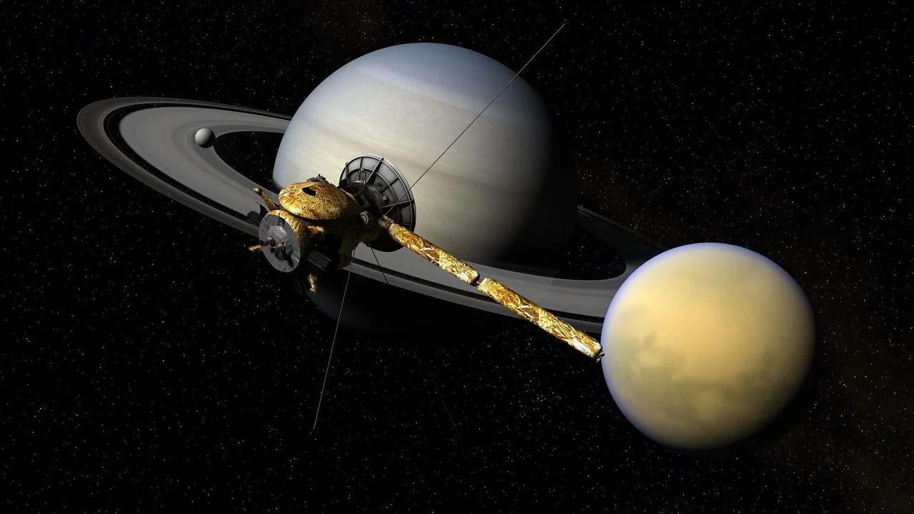 A spacecraft in front of an orb with rings.