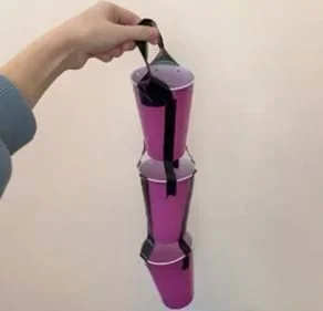 A photo showing an example of a shower clock with a descending succession of 3 cups being held together with duct tape.
