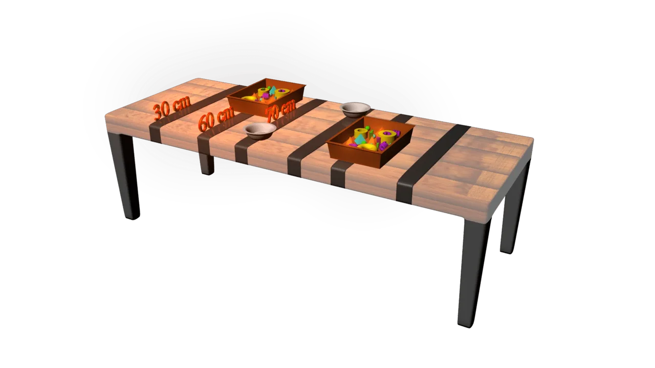 A 3D illustration showing a brown, wooden tabletop set up for a robotic arm challenge. The table features two brown rectangular bins filled with various small, brightly colored objects (yellow, purple, green, orange). There are two small, empty white bowls placed on the table, one near each bin. The image includes large orange text labels indicating distances, with "30 cm," "60 cm," and "90 cm" marked on the surface of the table.
