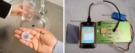 Two photos: In the palm of a hand, a disc-shaped container holds a computer chip. A PDA connected to a DAQ hardware circuit board and a battery.