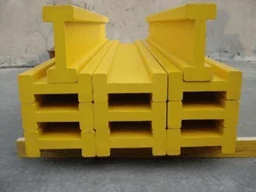 Photo shows stacked yellow pine lumber I-beams.