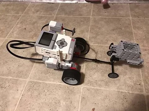Fourth experimental set-up showing the wheels with tires on a tile surface.