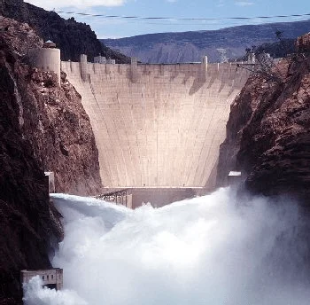 Water rushing through a hydroelectric dam
