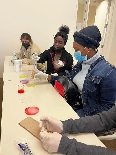 A student experiments with a hydrogel design in the laboratory.