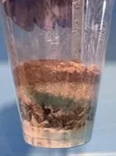 A photo showing the layering design where clay is the cap layer. Sand is placed in between gravel and clay.