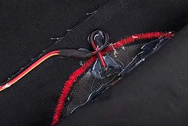 A photograph shows the wiring of a patch with a small loop made in the cable wiring near where it comes out from the EL panel.