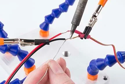 A photograph shows the EL panel cable being held with clamps and soldered to a new length of wire (ribbon cable).