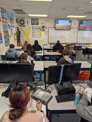 A photo showing students engaged in the activity.
