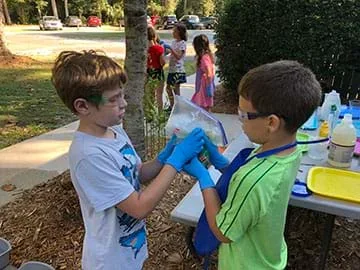 Students testing the washing machine prototype.