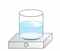 Beaker filled with water sitting on a hot plate.