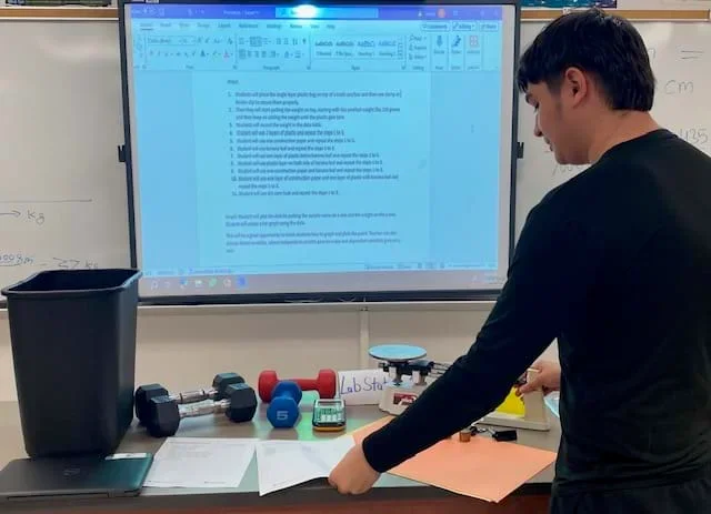 A photo of a student collecting the lab material while going through the procedure.