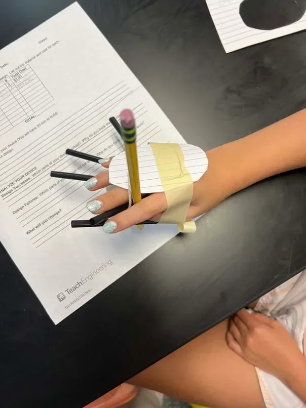 A photo showing a student testing their device.