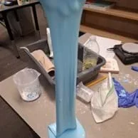 A photo showing students measuring how far their slime can stretch.