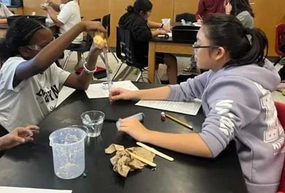 A photo showing students measuring how high their controlled slime can bounce.