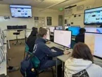 A photo showing students working on their lab computers.