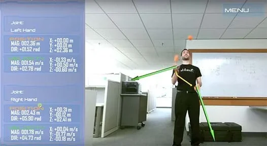 A photograph shows a student juggling three orange balls. Yellow arrows indicate the positions of his hands and green arrows indicate their velocities. To the side, a numerical display lists those quantities.
