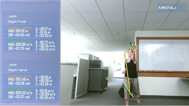 A photograph with arrows and data off to the side document a student martial artist performing a punch while being recorded using the ARK Mirror.
