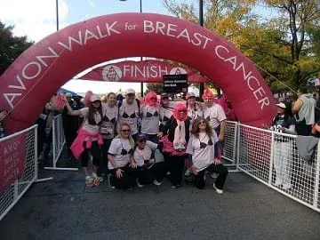 A group of participants take a photo for the 2012 Avon Walk for Breast Cancer in NYC.