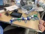 A photo of a completed polypeptide model and the Vernier LabQuest in the background showing when the bonds between the amino acids break.